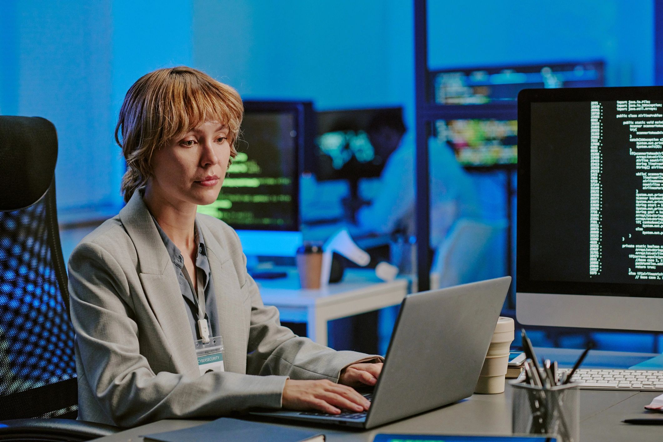 IT support specialist monitoring systems on a laptop