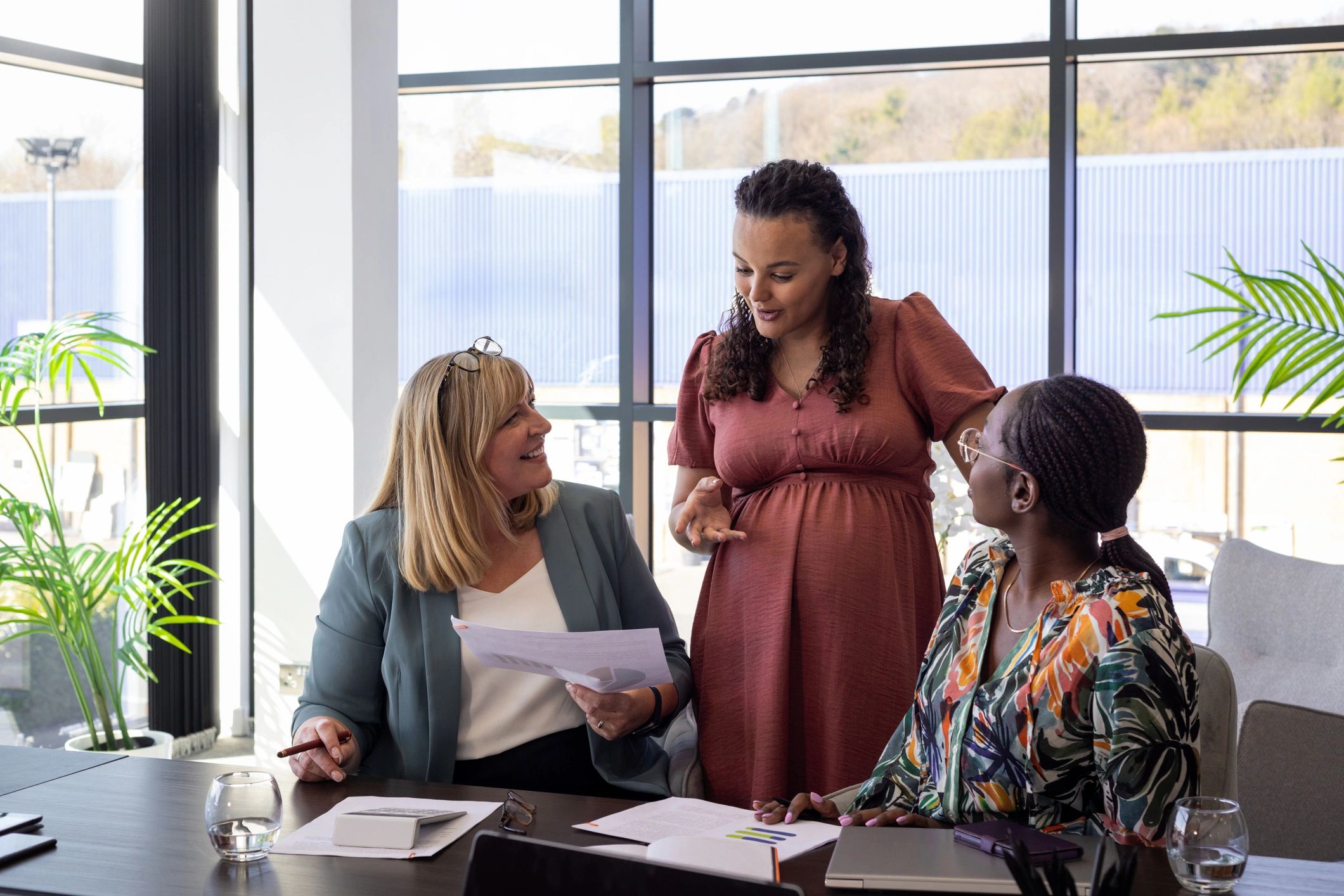 Consulting team discussing technology strategy during a business meeting