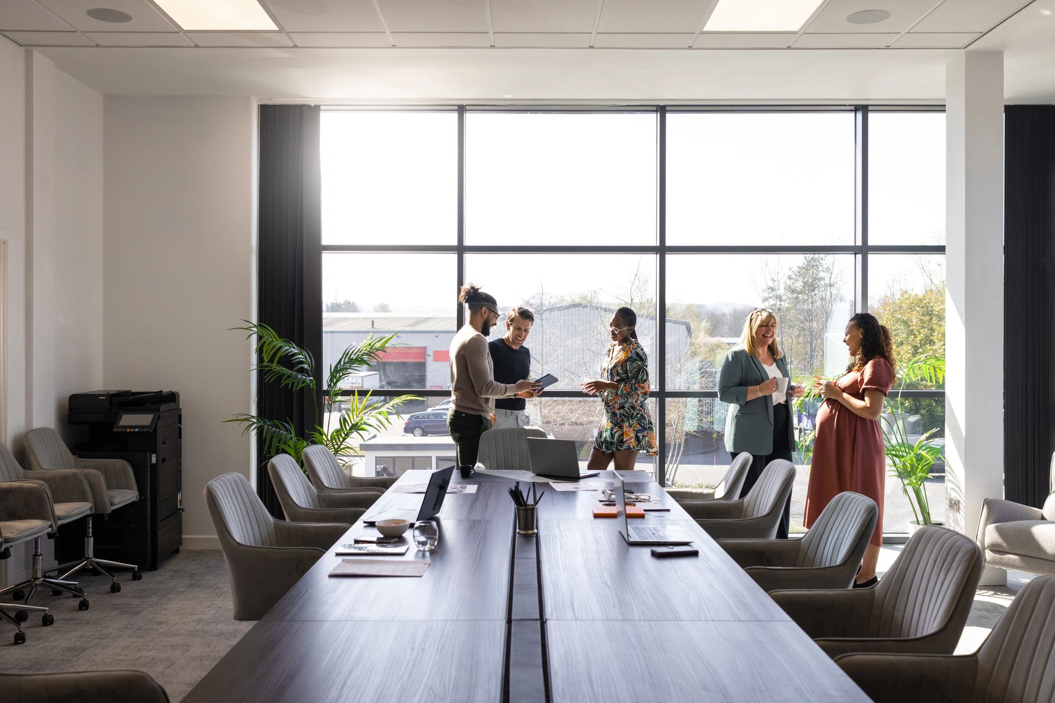 Business colleagues discussing technology strategy in an office